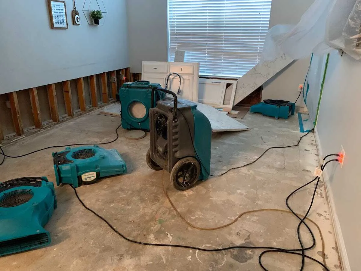 Dehumidifier in flood-cut room for Water Damage Restoration in Clinton